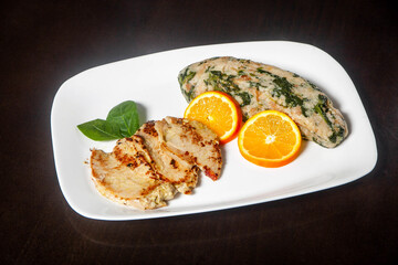 Grilled pork tenderloin with cilantro migas: A succulent dish showcasing tender meat paired with flavorful cilantro-infused breadcrumbs, a Portuguese delicacy.