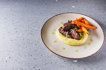 delicious stewed beef cheeks on mashed potatoes