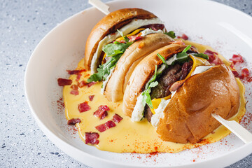 delicious cheeseburger with beef patty in a cheese bath