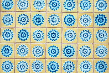 Portuguese yellow tiles with blue flowers.
