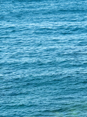 Vertical dark blue sea ripples background