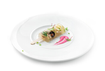 Delicious aspic or galantine with chicken meat, egg, greens and horseradish on plate isolated on white background. Healthy food, close up, top view