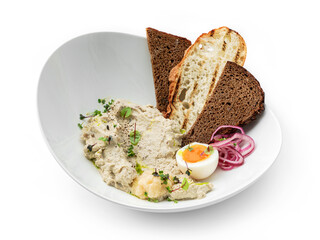 Delicious meat pate with mushrooms, egg, grilled toast and onions rings on plate isolated on white background. Appetizers and snacks, close up, top view