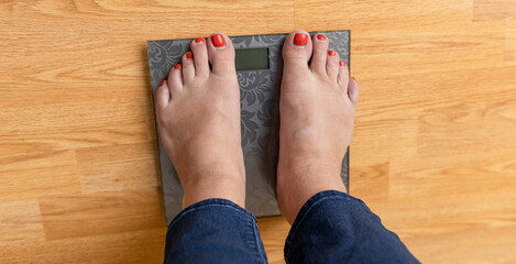 Lose weight concept with person on a scale measuring kilograms. Close-up