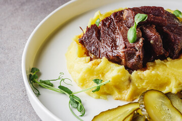 delicious stewed beef cheeks on mashed potatoes
