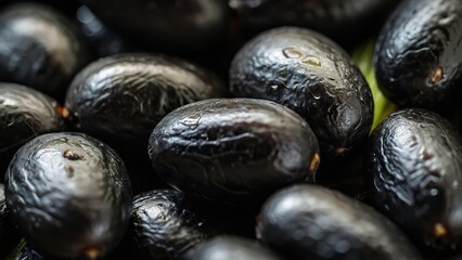 Obraz premium Macro shot of glossy black beans showing detailed texture and small size