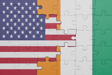puzzle with the colourful national flag of cote divoire and flag of united states of america .