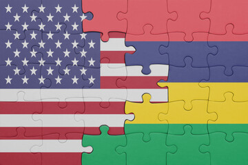 puzzle with the colourful national flag of mauritius and flag of united states of america .