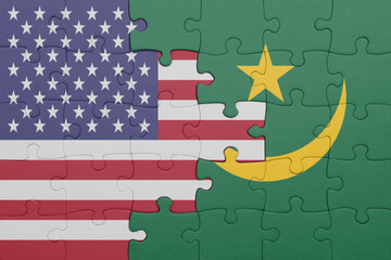 puzzle with the colourful national flag of mauritania and flag of united states of america .