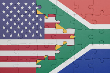 puzzle with the colourful national flag of south africa and flag of united states of america .
