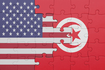 puzzle with the colourful national flag of tunisia and flag of united states of america .