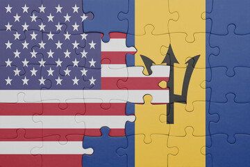Obraz premium puzzle with the colourful national flag of barbados and flag of united states of america .