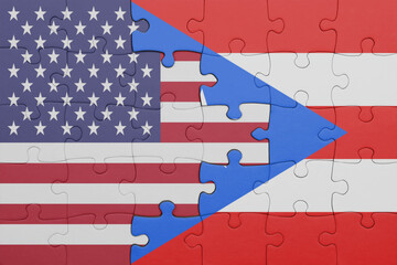 puzzle with the colourful national flag of puerto rico and flag of united states of america .