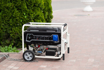 Power supply generator placed on street sidewalk. outdoor diesel power generator in Ukraine.