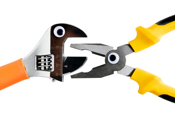 pliers and adjustable wrench facing each other and isolated, cartoonized with plastic eyes and open mouths, white background