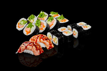Collection of maki rolls and nigiri sushi with salmon