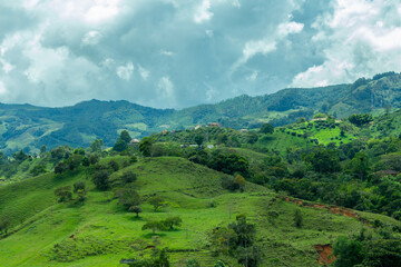 Obraz premium the majestic Andes Mountains around Jerico, Jericó, Antioquia, Colombia. Fields, banana trees. Green landscape. Cloudy sky.