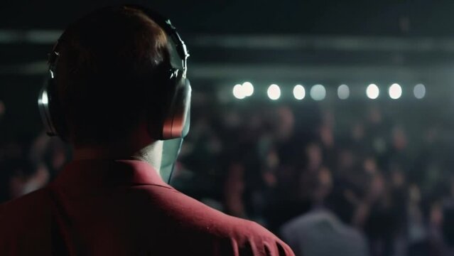 DJ Performing in Front of a Crowd at a Concer