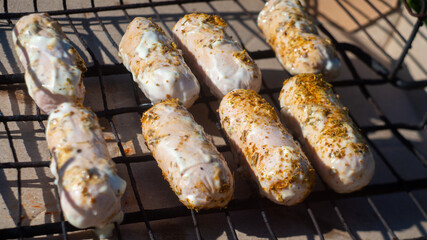 sausages in sauce, grilled on coals. outdoor picnics. barbecue and grill. delicious and healthy food