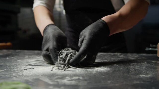Chef Flours Spaghetti Black Cuttlefish Ink At Guitar Frame Cooking Italian Dish