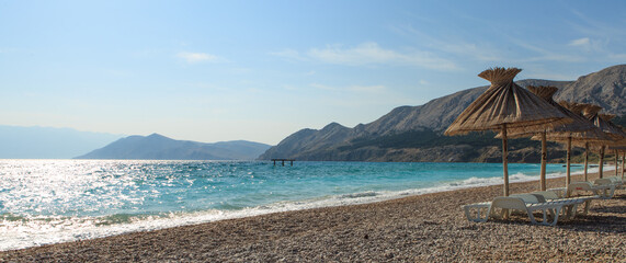 Parasol on the beach ib baska on the Island of Krk on Adriatic Sea