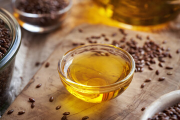 Flax seed oil in a glass bowl on a table