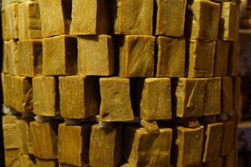 Rustic Stack of Handmade Laundry Soap Blocks in Market Stall
