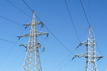 High Voltage Pylons Against a Blue Sky