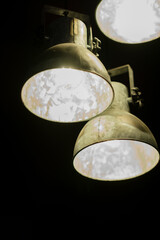 Metal lamps have burning bulbs.