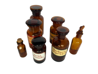 Vintage Amber Glass Pharmacy Bottles with Labels on White Background