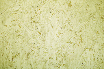 Chipboard OSB texture painted in yellow color.