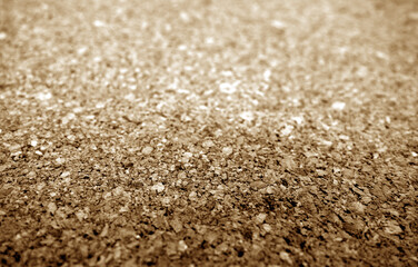 Cork advertising pin board texture close up with blur effect in brown color.