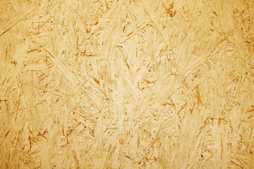 Chipboard OSB texture painted in orange color.