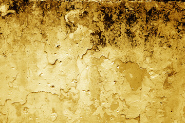 Grungy dirty plaster wall with peeling paint. Orange color style.