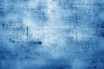 Scratched and weathered metal plate surface. Blue toned