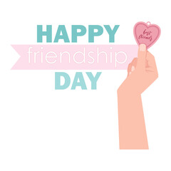 A woman's hand holds a friendship heart pendant on Friendship Day