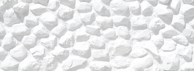 Empty monochrome black and white (light gray) embossed stone wall for abstract background and...