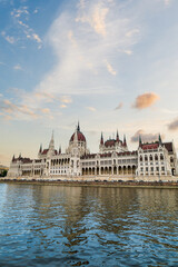 Fototapeta na wymiar Hungarian parliament building with sunset sky by Danube river, Budapest, Hungary