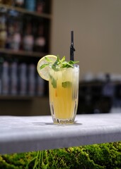 Glass of lemon soda on the bar counter