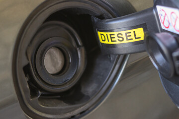 Fuel cap for diesel engine car closeup. Automobile tank refueling