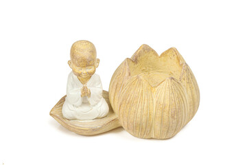 Wooden carved praying meditating 
buddhist monk candle holder home decoration isolated on white background
