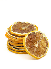 Stack of dry dehydrated lemon slices isolated on white background