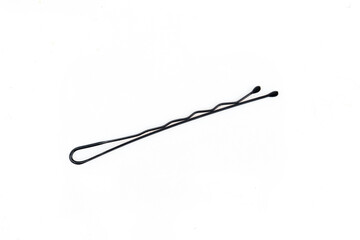 Single bobby pin isolated on white background. Simple hairpin hairstyle tool