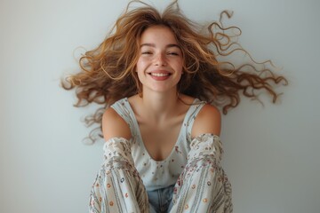Joyful woman with flowing hair and smile