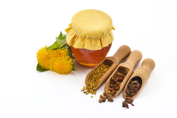 Honey Jar and Spices with Dandelion Flowers