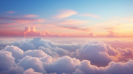 A dramatic cloudscape at sunrise with pink and golden glowing clouds against a clear blue sky