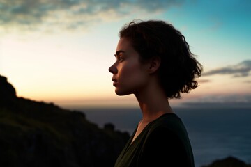 woman looking ahead at dusk