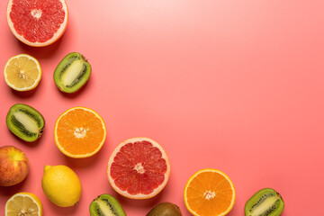 Creative fruit composition on pink background with hard shadows. Summer minimal concept.