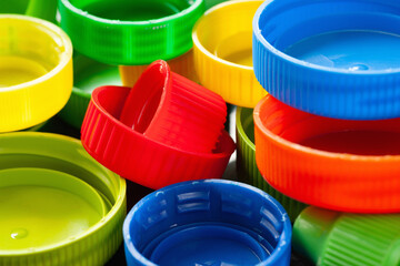 Plastic caps. Colored plastic caps. Plastic recycling. Selective focus