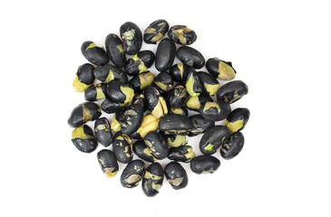 Pile of roasted black soybeans snack isolated on white background